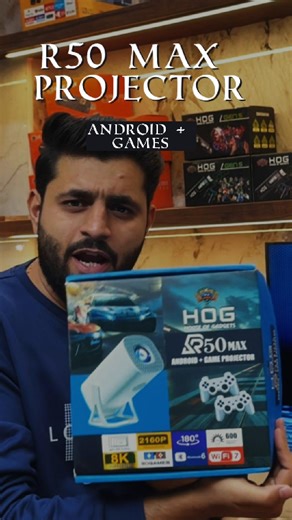 🎥 HOG™ R50 Max Android Plus Game Projector — your ultimate home entertainment upgrade! Experience stunning 8K supported visuals on a massive 250-inch display, powered by 600 ANSI lumens brightness for crystal-clear performance in any light. With built-in WiFi 7 and Bluetooth 6, it connects seamlessly to your laptop, mobile, PS5, Xbox, or Game Stick. Includes two heavy wireless controllers, perfect for gaming nights or family fun! Enjoy cinema-quality viewing, smooth auto-focus, and premium soun