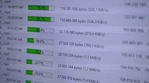 Process of uploading file on LCD computer monitor screen. Download bar progress. Vignette effect and pixel noise