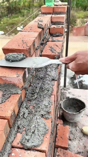 Laying Red Bricks with Cement Mortar and Guide Line for Professional Building Construction