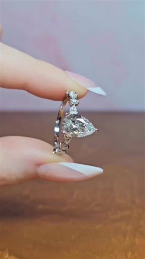 Love Grown Diamonds on Instagram: "Elegance with a unique twist ✨💍 💎 Elizabeth Pear Shaped Diamond Ring Featuring a 2.00ct pear-shaped centre Set in platinum with a stunning marquise & round diamond band 🔍 D Colour | VVS2 Clarity 💎 Total Diamond Weight: 2.50ct 📃 IGI Certificated ✔️ Lifetime Warranty & Resizing A pear-shaped beauty designed to stand out 🤍 DM for details ✉️ #PearShapedRing #ElizabethRing #UniqueEngagementRing #PlatinumRing #DiamondBand MarquiseDiamonds RoundBrilliant Engagem