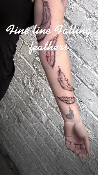 Falling Feather Tattoos: A Fine Line Design