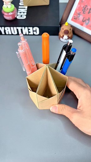 8.5K views · 58 reactions | Title: Origami Hexagonal Pen Holder Hashtags: #origami #hexagonal #penholder #craft #diy #paperfolding #handmade #deskdecor #stationery #creative #homemade #easycraft #recycle #papercraft #folding #geometric | paper craft ideas | Facebook