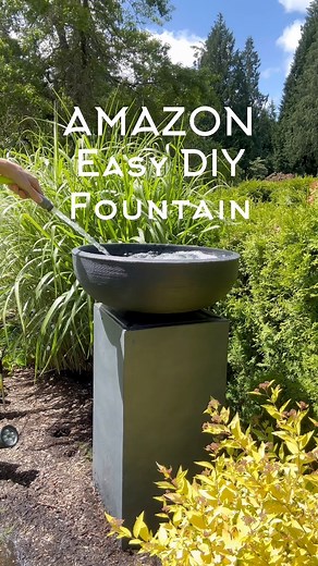 Do you love the look and sound of a water feature? 🤷🏼‍♀️ Comment LINK or shop here: https://urlgeni.us/amzn/Fountainpicture ✨This DIY fountain is my favorite thing I’ve done in our backyard and it was so easy! My whole family loves it! The solar fountain stores energy from the day’s sun and runs for a few hours into the night. Works all year long even in cloudy rainy Seattle! It lasts longer than my bedtime let’s just put it that way 😜 XO ~ Julie #backyardgoals #backyarddesign #amazon #diypro