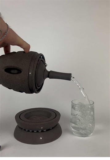 Smooth pour from my latest double walled bottle in black stoneware, just back from a national pottery show and happily sold to a new home.