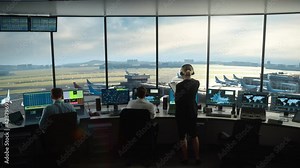 Diverse Air Traffic Control Team Working in a Modern Airport Tower. Office Room is Full of Desktop Computer Displays with Navigation Screens, Airplane Flight Radar Data for Controllers.