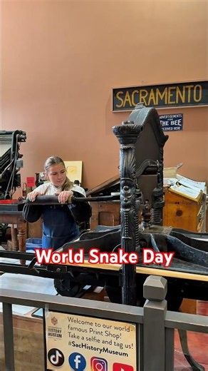 Printing a linoleum cut of a snake for World Snake Day (July 16)