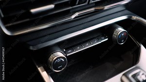Shown are different parts of the car interior. Control panel in a modern car. Climate control buttons.