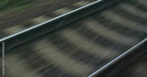 Train cargo by rails. Dark, gloomy train tracks, close up. Goods transportation over long distances by train rails. Import, export by train line. Railroad track. Railway logistic. Transport industry