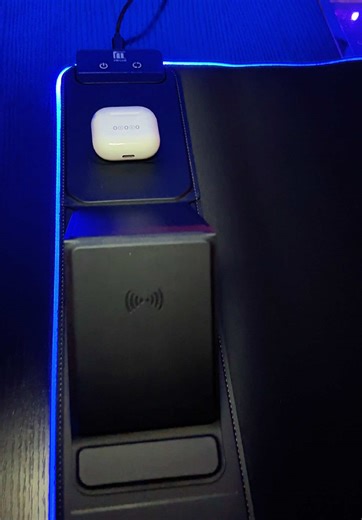 Transform your desk into a clean, high-tech workspace with this XXL RGB LED gaming mouse pad featuring dual wireless charging zones built directly into the desk mat. This extended gaming desk mat combines a large smooth mouse surface with convenient wireless charging so you can power your phone and wireless earbuds while gaming, working, or streaming without cluttering your desk with extra cables. The oversized desk mousepad creates a full workstation surface for your keyboard, mouse, and access