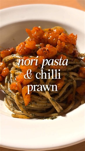 Viral nori (roasted seaweed) pasta with chilli prawn crumble 💖 Recipe below 👇 Ingredients: 3 packets seaweed snacks 1 tbsp roasted white sesame seeds 1 tbsp sesame oil 2 tbsp soy sauce (plus extra for pasta water) 1 tsp sugar 1/3 cup parmesan, grated 1 garlic clove, grated 1 egg yolk Prawns, roughly chopped Olive oil Chilli crisp Salt Pasta noodles of choice Method: Blend seaweed snacks and sesame seeds until you get a powder Scrape into a bowl with sesame oil, soy sauce, sugar, parmesan, garl
