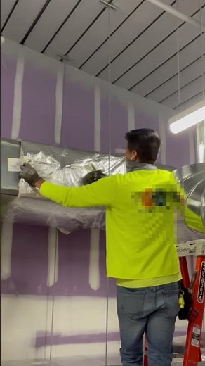 Stapling fiberglass duct wrap to HVAC outside air duct #hvac #construction #airconditioner #work