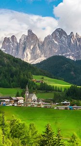 Time Lapse Dolomites Italy landscape at Santa Maddalena or St. Magdalena village at foot of Ruefen Mountain. The beautiful mountain landscape attracts tourist to Dolomites travel in Northern Italy.