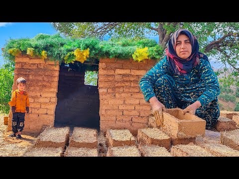 Building a very beautiful mud hut in the mountains by a village woman