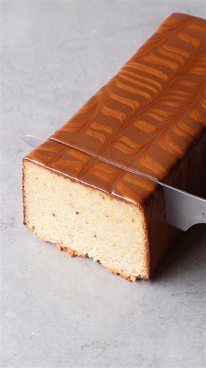 This is such a simple loaf cake to make, with tons of flavour from the brown butter, vanilla and orange zest. I finished mine with a chocolate glaze a fun feathered design. Find the full recipe here: https://mattadlard.com/recipes/brown-butter-and-orange-cake/ | Matt Adlard