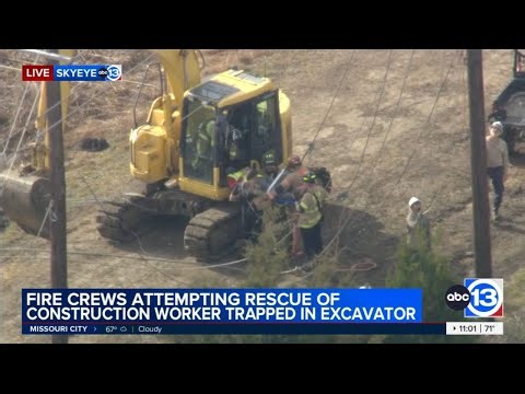 Operator rescued after backhoe gets tangled up in power line in Clear Lake, video shows