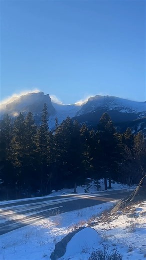 🏔️ This is what 50 mph winds on a 12,713-foot peak looks like. ❄️ I pulled over on Bear Lake Road. Grabbed my phone. And just... watched. Hallett Peak. High winds. Snow streaming off the summit like smoke. And all I could think was... DAMN. Nature is absolutely WILD. You can FEEL the power from the road. The way the snow just RIPS off the peak. The way it spreads across the sky. The way the mountain just... takes it. Like it's been doing this for thousands of years. Because it has. This isn't r