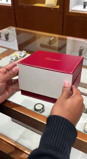 The Cartier Santos Large W2SA0030 two-tone might be the most versatile luxury watch right now. Everyone's chasing steel sports icons… meanwhile this anthracite gray dial yellow gold bezel combo quietly delivers aviation history, QuickSwitch versatility (metal to leather in seconds), blue spinel crown pop, and that unmistakable Santos shape, all in a wearable 39.8 mm package. In the box it just hits different. #cartier #LuxuryWatches #watches | Quack World