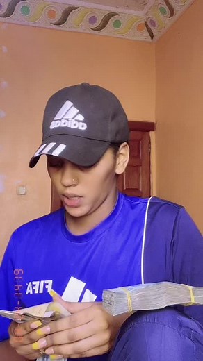 Adidas Jersey Fan Counts Large Stack of Money