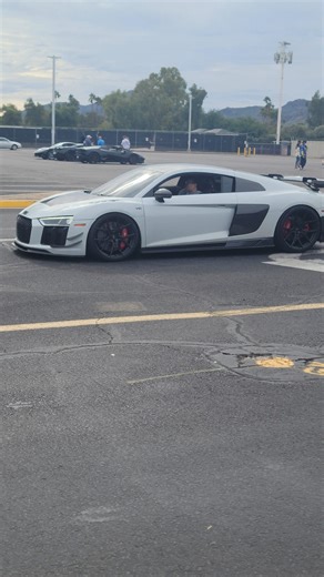 beautiful modified Audi r8 in white and carbon fiber leaving car show