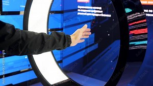 Virtual reality check. Media.A huge machine showing different icons from a computer that reacts to hand movements.
