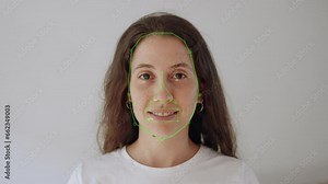 Ai face detection tracking and recognition algorithm on young woman face. Artificial intelligence A.I. recognizing and identifying facial features and gestures of female looking at camera frontal