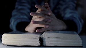 Praying to God with bible faithfully worshipping with people stock footage stock video | Premium Stock Video Footage