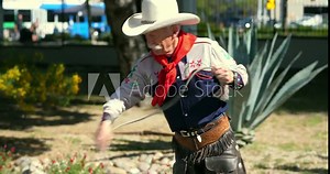 American cowboy throws a lasso rope at the ranch before rodeo, 4k