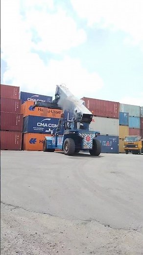 Kalmar Reach stacker with a tilting spreader for container handling