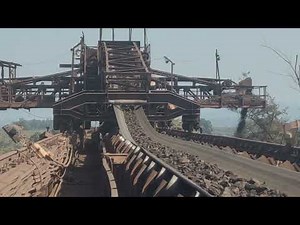 Belt conveyor carrying iron ore ll crushed iron ore carried by belt conveyor