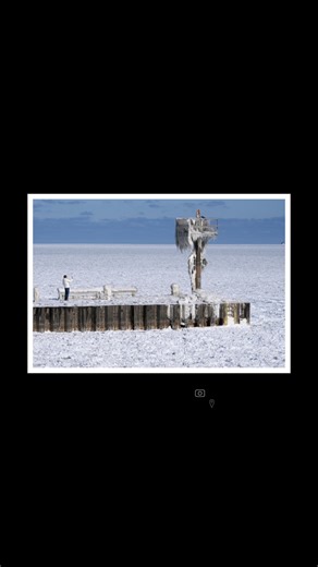 One place that’s really ready for temperatures to warm up? Chicago. Where weeks of frigid arctic air have led to incredible scenes like this one, of a person photographing a harbor light caked in ice and snow above a frozen Lake Michigan. | The Weather Channel