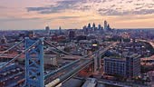 Aerial view Ben Franklin Bridge and Philadelphia skyline with slow...
