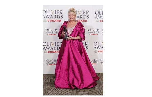 Dame Elaine Paige wows at Olivier awards in pink opera coat by Halifax 'designer to the stars' Kevan Jon