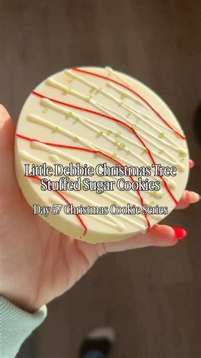 Nothing says Christmas like Little Debbie’s Christmas Tree Cakes 🎄 So I turned them into stuffed sugar cookies. Soft, buttery cookies filled with Christmas Tree Cake buttercream made with real mashed Christmas Tree Cakes. It’s holiday baking at its absolute peak. 🍪✨ Day 57: Christmas Tree Stuffed Sugar Cookies 🎄 Don’t miss my Christmas Cookie Series, follow along! Recipe in comments! Cooking with Karli christmas cookies | christmas baking | holiday baking | cookie series | stuffed cookies | s