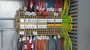 Terminal blocks in electrical cabinet. Cable connector. Industrial electrical equipment and wiring. Terminal blocks for electrical connection, electrical panel at a assembly with number tag equipment