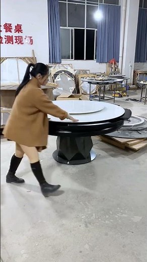 round black dining table featuring a built-in white lazy Susan (rotating tray) on top