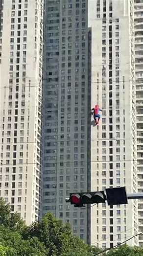 Omg real Spider-Man climbing to the building