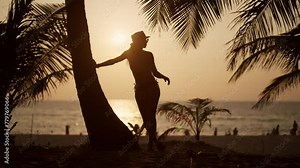 Woman relaxes on tropical island beach. Pretty woman in bikini admire view under palm tree on sand beach coastline tropical exotic island near sea ocean. Travel on summer, paradise vacation concept.