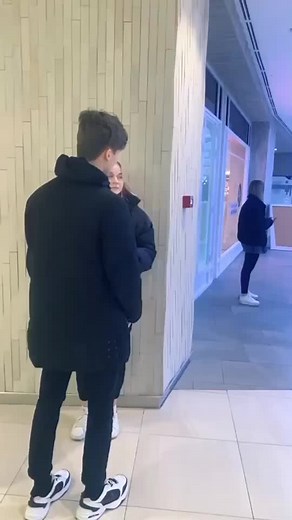 Emotional Moments Between Young Adults in Modern Setting