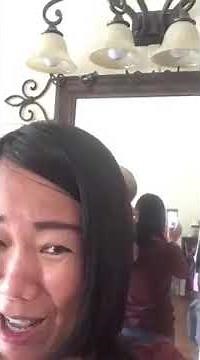 Husband cutting wife’s hair