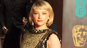 Haley Bennett dazzles in black leather and gold sequined gown