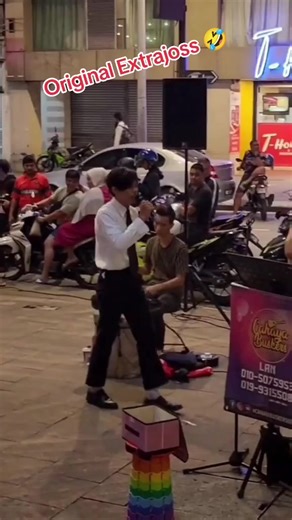Street Performer Captivates Night Audience with Music
