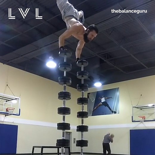 This is some seriously impressive balancing! 🤸🏼‍♂️🔥 | Level Fitness