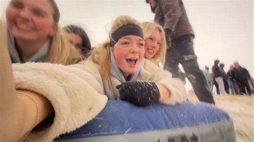 Go snow sledding down a hill on the University of South Carolina campus with these USC students. | The State Newspaper