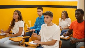 Group of adult students learn the rules of working in a taxi while sitting in a driving school class