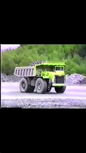 Dump Truck Navigates Rocky Terrain to Unload - UK Opencast