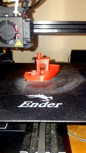 I think I'm getting the hang of this 3D printer. I've been doing maintenance on it all day, trying to calibrate everything just right. This is my fourth run of the test boat. It looks way better than the first three tries. Trust and believe me, now on to a different task. What should I try to 3D print next? | Ingram Heard