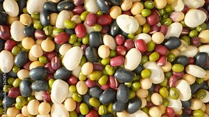 Bean mix: A delightful blend of assorted beans, rich in colors, textures, flavors. Captured through a probe lens, revealing the intricate details, vibrant hues. Grain concept. Beans background