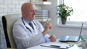 Confident Doctor Smile and Make No Finger Sign a Warning Gestures