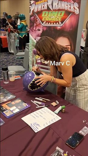 Claire Blackwelder aka Kendall signs purple Dino Charge helmet @rangerstation 2024