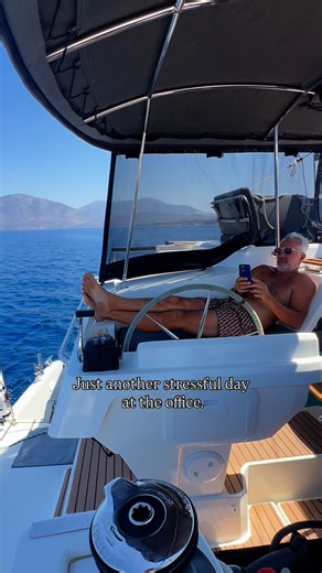 Ana & Steph | World Vagabonds on Instagram: "Office on the Ocean. He’s got coffee, autopilot and a new anchorage waiting. 🌊 ⚓️ #myboatandi2025 #officeonthego #oceanoffice #boatlife #nomadsforlife #nomadiclife #liveaboards #liveaboardlife #catamaran @fountainepajot"